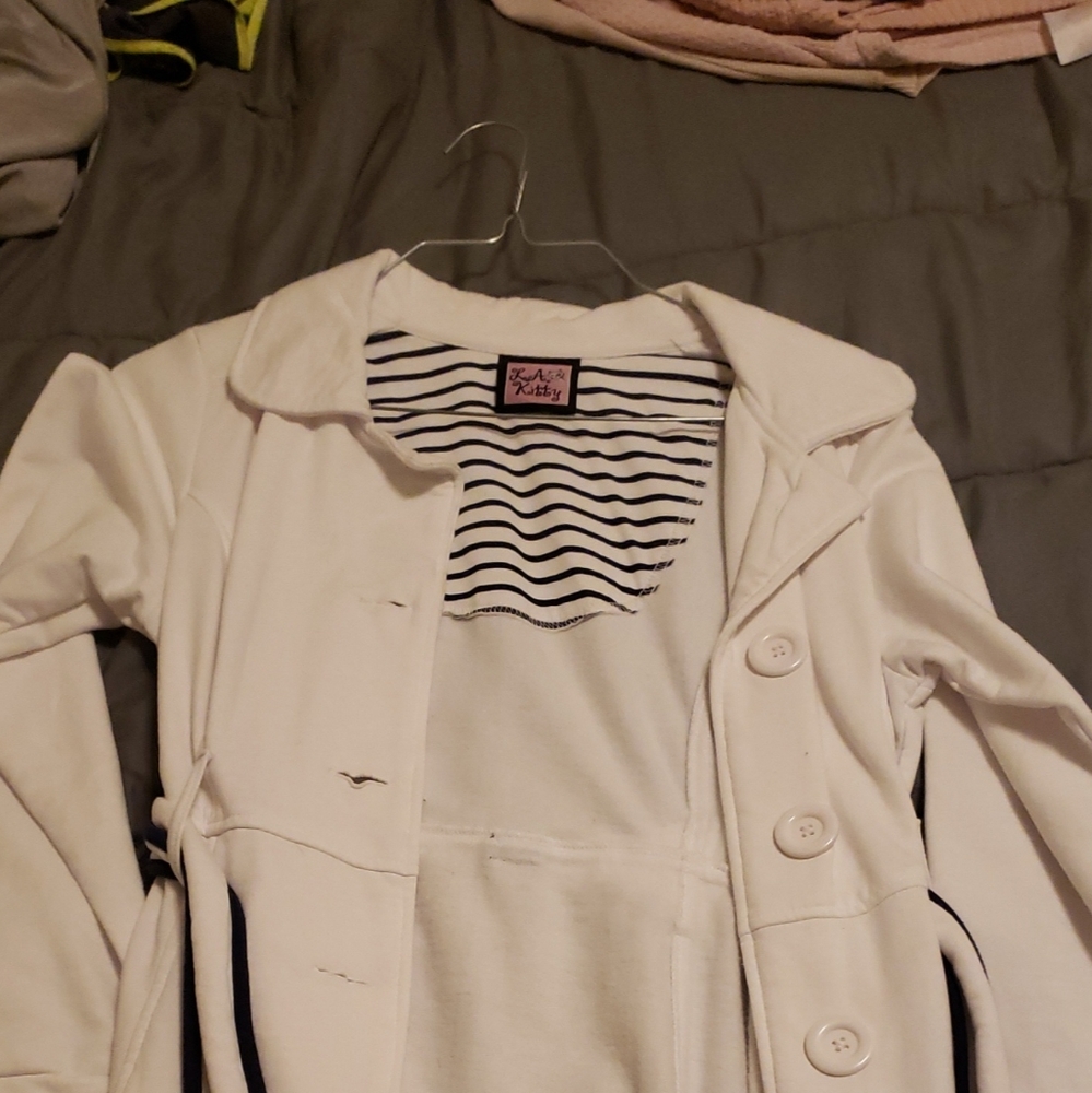 White with blue accent coat